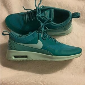 Teal women’s Nike shoe